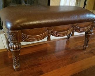 Leather upholstered ottoman