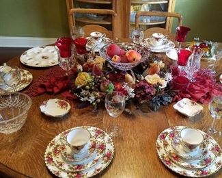 On the dining table is a set of 'Old Country Roses' china by Royal Albert
