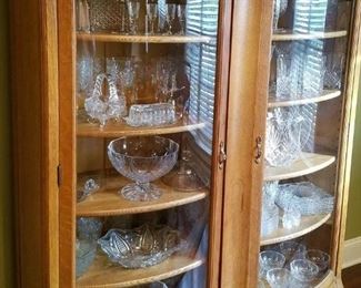Antique oak china cabinet with curved glass