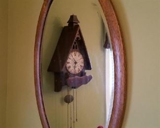 Antique oak framed oval mirror