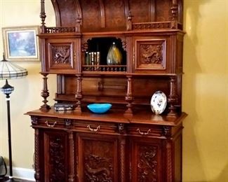 This  beautiful antique walnut hutch was hand carved in Germany.
