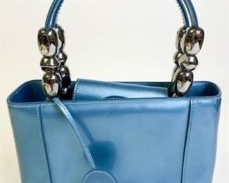 6	Blue Vintage Christian Dior Purse	Double-handled handbag with authentication card; magnetic closure; Pen mark on the back side 9" l x 7" w x 3" d
