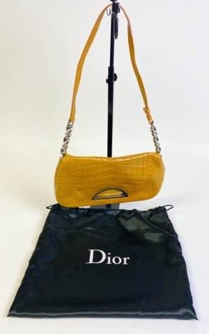 Christian Dior Alligator Malice Shoulder Bag	Christian Dior shoulder bag in tan alligator with silver tone hardware, single should strap with slight wear, leather lining and single interior pocket, snap closure at front, pen mark on inside flap, marking on handle, good condition, 10 1/2" x 5 1/2"
