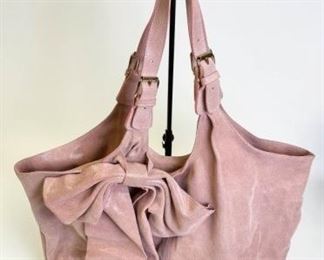 35	Red Valentino Pink Leather Bag with Bow	Red Valentino dusty pink pebbled shimmer leather bag with large bow accent, gold tone hardware, dual adjustable straps, unlined and single interior zipper pocket, magnetic snap closure, some minor marks on outside and inside 22"l x 15" h x 6" w
