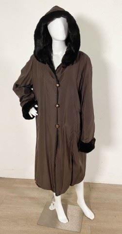 42	Brown Silk Reversible Coat with Mink Lining	Lot includes brown silk coat reversible to brown dyed sheared mink with hood and turn back cuffs, 42"L, good condition
