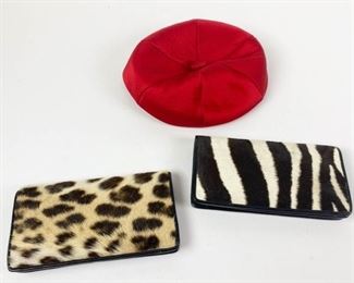 50	Vintage Animal Print Clutches and Hat	Lot includes black leather and zebra snap closure clutch, some marks consistent with age and wear, 4 1/2"H, 8 1/4"L; black leather and leopard snap closure clutch, some marks consistent with age and wear, 4 1/2"H, 8 1/4"L; red satin Miss Carnegie hat, 9" diameter, good condition.
