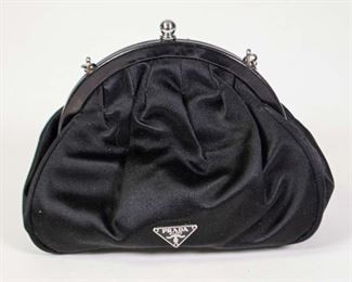 59	Prada Black Satin Clutch	Prada black satin clutch with chain, good condition, 5 1/2"H, 7"W, 2"D
