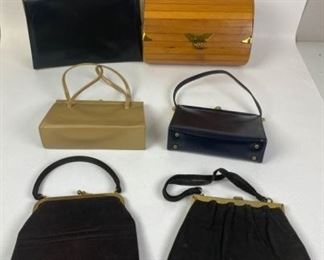 73	Grouping of Vintage Handbags	Lot includes Crouch and Fitzgerald black leather handbag with single handle, gold tone hardware and clasp, red leather interior with multiple pockets, marks and wear consistent with age, 8 1/2"H, 12 1/2"W, 3 1/2"D; brown suede Koret handbag with single handle, clasp closure, satin lining with satin coin purse included, wear consistent with age and use, 8 1/4"H, 9"W, 2"D; black suede Crouch and Fitzgerald handbag, gold tone hardware and snap clasp, satin lining with two slip pockets, leather worn on handles, marks and wear consistent with age, 8 1/4"H, 10"W, 1"D; tan leather Crouch and Fitzgerald handbag with gold tone hardware and accents, double handles, suede lining, multiple pockets, marks and wear consistent with age, 6 1/4"H, 9"W, 2 3/4"D; Coblentz black leather evening bag with gold tone accents and clasp, grosgrain lining with two slip and one zippered pocket, wear consistent with age and use, 6"H, 8 1/2"W, 2 1/2"D; vintage wood (bamboo) flap bag 