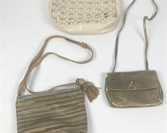 75	Grouping of Furla, Sharif, Cole Haan Handbags	Lot includes Furla metallic leather evening bag with gold tone hardware, single shoulder strap, twist clasp, leather wearing in interior, includes dust bag, exterior in good condition, 5 1/2"H, 7 1/2"W, 1"D; Sharif multi color metallic bag with zippered closure, adjustable shoulder strap, zippered interior pocket, some minor wear, 8"H, 7"W, 4"D; Cole Haan ecru leather woven handbag, silver tone hardware, single shoulder strap, zippered closure, multi interior pockets, minor wear, good condition, 9"H, 11 1/2"W, 3 1/2"D
