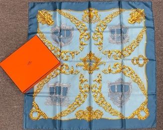 82	Carrosses d' Or Hermes silk scarf	Carrosses d' Or Hermes silk scarf, some marks from age and use, 35"square, some wear, with Hermes box, tear in corner of lid
