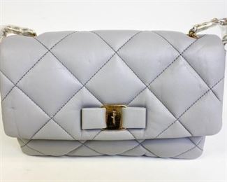 88	Gray Salvatore Ferragamo Quilted Purse - Brand New	From the Vara Soft Quilted Collection. Softly quilted design with signature bow. Fold over flap with magnetic snap. Goldtone hardware. One inside zip compartment. grosgrain lining. Woven chain crossbody strap, hidden push closure, excellent condition 9"l x 5.5" h x 3" w
