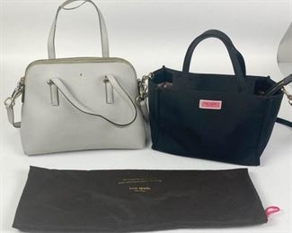 96	Grouping of Two Kate Spade Handbags	Lot includes one Kate Spade grey saffiano leather handbag, double handles with removable adjustable leather shoulder strap, silver tone hardware, zipper closure, two slip interior pockets, one zippered interior pocket, logo jacquard lining, protective feet on bottom, some minor marks on lining, one handle has some damage, creasing in one corner, some marks from wear, fair condition, 9"H, 11 1/2"W, 4 3/4"D; Kate Spade black nylon handbag with removable shoulder strap, silver tone hardware, zipper closure, pink grosgrain lining, two interior pockets, includes one dust bag, minor wear, good condition, 7 1/2"H, 10"W, 5"D
