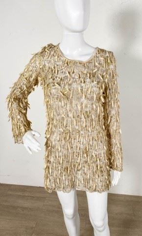 110	Escada Couture Metallic Tunic Top	Lot includes Escada Couture metallic embroidered tunic with leaf and sequin embellishments, 16" at shoulders, 31"L, lightly worn, good condition

