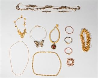 129	Grouping of Gold and Copper Tone Costume Jewelry	Lot includes gold tone Cecile Jeanne necklace, gold tone large link Michael Kors choker, copper tone Marc Jacobs large chain link bracelet, hammered copper tone bangle, two 24 kt gold plated snakeskin bracelets, two gold tone chain necklaces, gold tone mesh choker with Egyptian pendant, Dabby Reid gold tone beaded necklace, Heidi Klum butterfly gold tone choker, ; longest is 92 inches.
