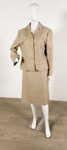 139	Barney's Wool Skirt Suit	Lot includes Barney's New York three button jacket, size 46, 18" at shoulders, 23"L, 23" sleeve, matching skirt size 46, 36" waist, 25 1/2"L, oatmeal color with metallic threading, 88% wool, 10% silk, 2% rubber, good condition, light wear throughout.
