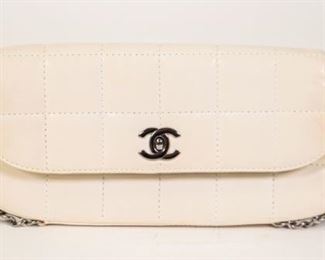 150	Chanel Square Quilted Leather East West Baguette	Chanel East West baguette flap bag, white leather, dual interwoven chain link detail continues as shoulder straps, fabric interior with Chanel logo, some wear, marks consistent with use, 4 3/4"H, 10 1/4"W, 1 1/2"D
