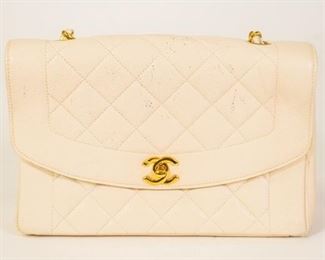 152	Chanel White Quilted Vintage Diana Flap Bag	Chanel single flap bag in white caviar leather, gold-tone hardware, one open pocket on exterior, two interior pockets, chain-link and leather shoulder strap, some marks and scuffing on exterior, pen marks on interior, 5 1/2"H, 9 1/2"W, 3"D

