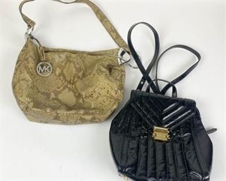 156	Lot of Michael Kors Handbags	Lot includes Michael Kors black Whitney backpack, new with tags, gold tone hardware, chain trimmed shoulder straps, minor scratch on clasp, includes dust bag, excellent condition, 9 1/2"H, 9 1/2"W, 4 1/4"D; Michael Kors python handbag with single shoulder strap, silver tone hardware, zippered closure, multi slip pockets and one zippered interior pocket, minor wear from use, good condition, 10"H, 13"W, 5"D
