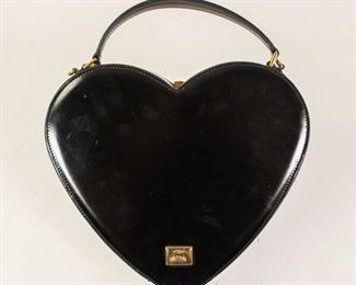 203	Moschino Patent Heart Shoulder Bag	Moschino shoulder bag, black patent leather, gold tone hardware, flat handle and single removable shoulder strap, jacquard lining, push lock closure at top, some wear consistent with use (scratches, marks), 8"H, 9"W, 3"D
