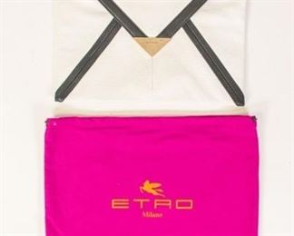 206	Etro White Leather Clutch	Etro Milano white leather clutch with black leather accents, silver tone hardware, magnetic closure, leather wrist strap, two open pockets, paisley fabric lining, one interior zippered pocket, dust bag included, minor marks consistent with wear, 10"H, 13"W
