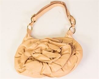 210	Yves Saint Laurent Blush Leather Floral Bag	Yves Saint Laurent leather floral ruffle shoulder bag, single adjustable shoulder strap, gold tone hardware, suede lining, two interior pockets (one open, one zippered), includes authentication card, some minor wear, good condition, 8"H, 12"W, 2"D
