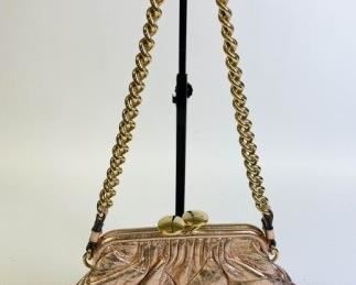 220	Marc Jacobs Copper Metallic Stam Bag	Marc Jacobs copper metallic patchwork leather bag with gold tone chain, frame opening secured by a kiss-lock, lined with grey linen fabric, made in Italy, authentication card included, good condition, 12"L x 8"D
