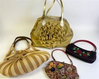 230	Grouping of Handbags	Lot includes Isabella Fiore beaded black handbag lined with red fabric, 10 1/2" L, small mark on outside, good condition; framed tapestry handbag with leather flower appliques and multi strand leather strap, 11"L, good condition; striped straw bag with gold tone accents, double handles reinforced with faux leather, 18"L, minor wear, no rips or holes; gold tone double handled nylon bag with large flower motif, matching zipper pouch, 15"L, two marks on outside.

