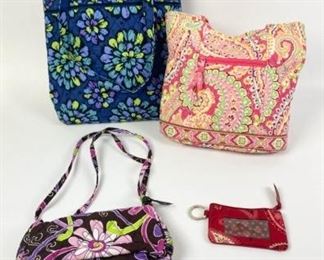 231	Grouping of 4 Vera Bradley Bags	Lot includes 4 Vera Bradley fabric bags: blue double handled tote bag, 13 1/2"H, 12"W, 4"D; peach double handled bag, 11"H, 11"W, 4 1/2"D; brown zippered bag with adjustable handle, 4 1/2"H, 8"W, 3"D; coin/id zippered purse, 3 1/4"H, 5"W; all bags have marks consistent with use, good condition.

