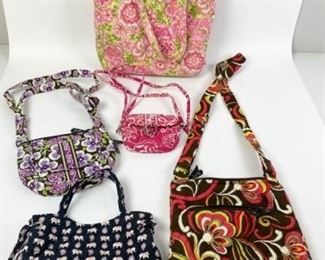 232	Grouping of 5 Vera Bradley Bags	Lot includes five cloth Vera Bradley bags: pink tote, 13 1/2"H, 11 1/2"W, 4"D; brown zippered bag with single handle, 11"H, 11"W, 1"D; purple zippered bag with single handle, 7"H, 9"W, 1"D; black double handle bag, 6"H, 9"W, 5"D; small pink with adjustable strap, 5"H, 5 1/2"W, 1"D, all have minor marks from use, good condition.
