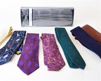 239	7 Perry Ellis Designer ties and cummerbund	7 Perry Ellis ties including a bird and owl design and floral designs as well as solids and wool ties also includes checker boxed set with cummerbund. size 1
