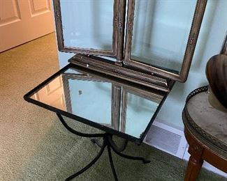 Antique double picture frame; glass-top accent table with metal base.