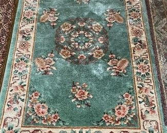 Numerous wool Oriental rugs to include Karachi and Couristan, among others.