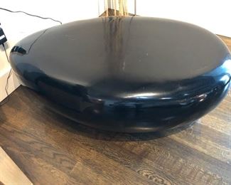 River Stone Cocktail table with black gel coat. 40" long x 25" wide x 14" tall. $500