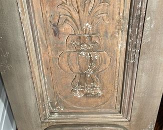 PAIR ANTIQUE CARVED DOOR MIRRORS | Originally sold by Pottery Barn; mango and mahogany wood with a hand-carved and hand-painted distressed finish made from an antique door, with beveled mirror glass; h. 98 x 22 in. 