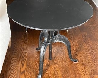 ROCKWELL CRANK SIDE TABLE | Rockwell crank adjustable side table by Four Hands, round top, made from refurbished steel and cast iron from old factories and warehouses, table height adjusts from 18 to 26 inches; dia. 35-1/2 x min h. 18 in.; original price $529 