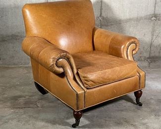 BROOKLYN LEATHER ARMCHAIR | By Pottery Barn, made to order Burnished Bourbon leather finish, Edwardian style chair with pleated roll arms outlined with nailheads, caster feet in an espresso finish; overall h. 35 x w. 37 x d. 36 in.; original price $1,399 