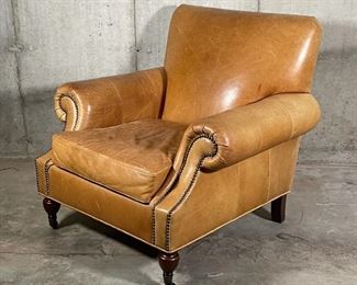 BROOKLYN LEATHER ARMCHAIR | By Pottery Barn, made to order Burnished Bourbon leather finish, Edwardian style chair with pleated roll arms outlined with nailheads, caster feet in an espresso finish; overall h. 35 x w. 37 x d. 36 in.; original price $1,399 
