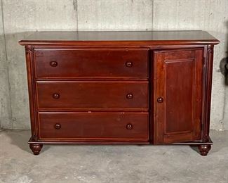 SOLID WOOD DRESSER | Three stacked drawers flanked by a side cabinet, with some carved baroque accents; 34-1/2 x 55 x 18 in. [some wear to finish, cabinet door remains ajar] 
