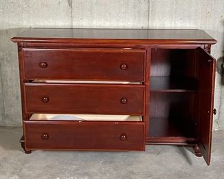 SOLID WOOD DRESSER | Three stacked drawers flanked by a side cabinet, with some carved baroque accents; 34-1/2 x 55 x 18 in. [some wear to finish, cabinet door remains ajar] 