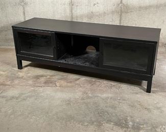 MEDIA CONSOLE | Dark stained wood TV stand with two glass window sliding doors, three partitions and removable shelving; 19-1/2 x 56-1/2 x 16-1/2 in. [some scratches to finish] 
