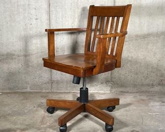 RETRO OFFICE CHAIR | Retro banker's style swivel desk chair with slatted backrest and open arms, with piston adjustments and recline; h. 34-1/4 x w. 24-1/2 x d. 24 in.