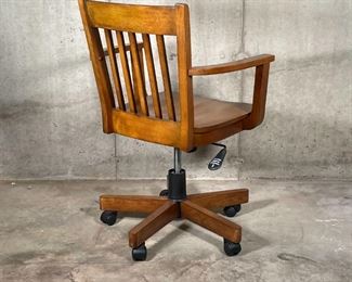 RETRO OFFICE CHAIR | Retro banker's style swivel desk chair with slatted backrest and open arms, with piston adjustments and recline; h. 34-1/4 x w. 24-1/2 x d. 24 in.