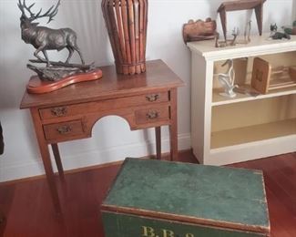 Small table, assorted decor, seaman’s chest