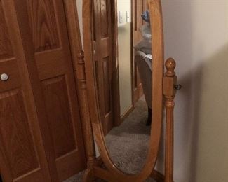 Oval mirror on stand.