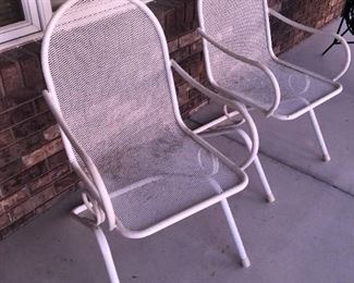 Two white metal chairs 