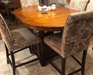 Nice counter height table with 4 upholstered chairs
