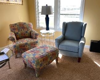 There is a pair of each of these chairs-

2 blue ones
2 colorful ones with ottoman
