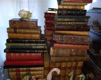 Antique leather bound books plus other books.
