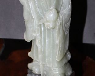 Stone Man with Bird on Pedistal