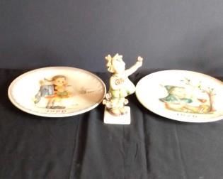 Hummel With Ceramic Flowers.